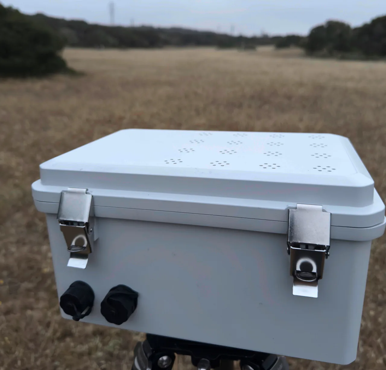 A Chorus acoustic sensor mounted on a tripod during field testing at Fort Ord, California.